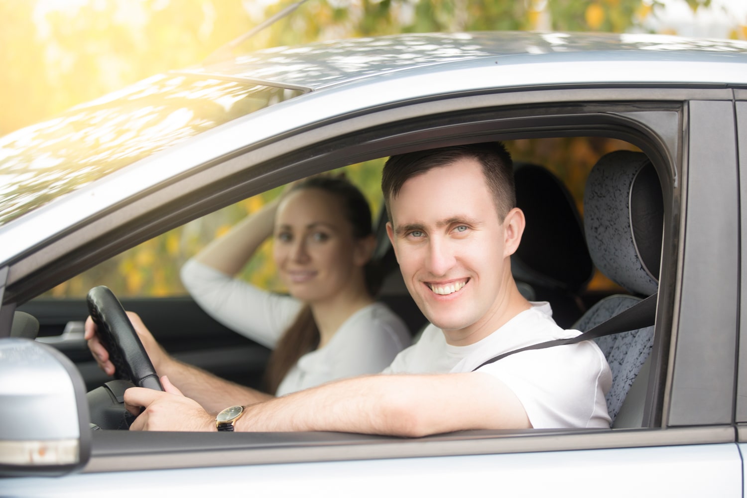 peer-to-peer car driver smiling with passenger