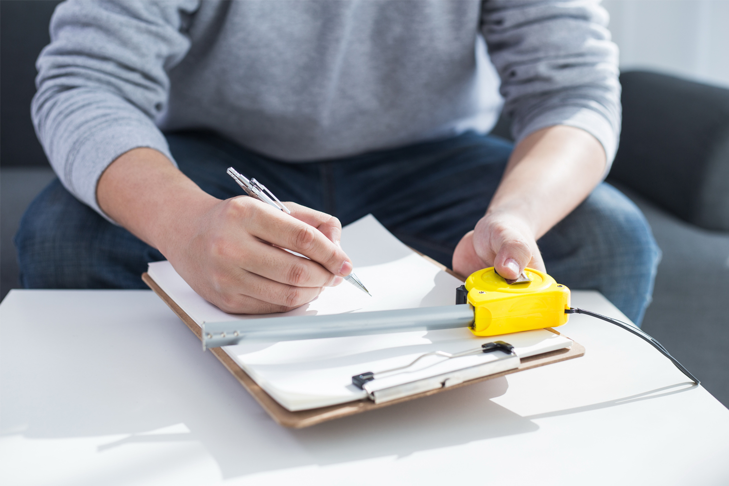 man checking measurements