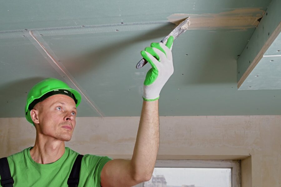 Man fixing ceiling