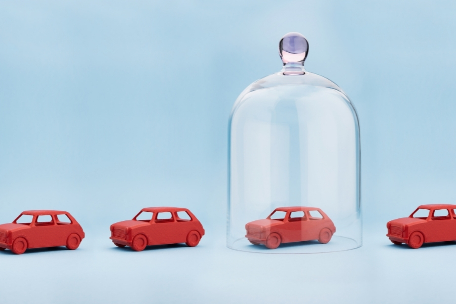 toy car trapped in a glass dome