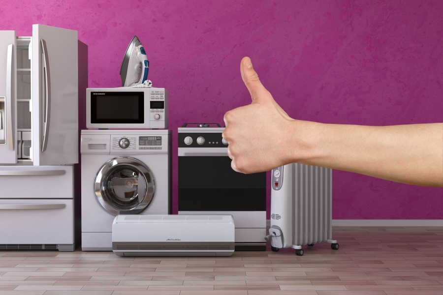 house appliances on the background with a thumb up in front