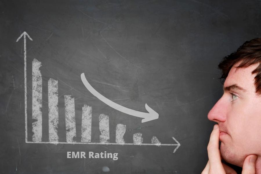 man looking at EMR rating chart. Chart showing decrease